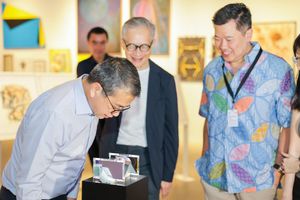 Mr Edwin Tong, Minister for Culture, Community and Youth and Second Minister for Law looking at Shin Beomsun, _Tales in Stone In Search of the Language of Primordial Paradise_ (2022). Singapore Biennale 2022: _Natasha_ (16 October 2022–19 March 2023). Courtesy Singapore Art Museum.